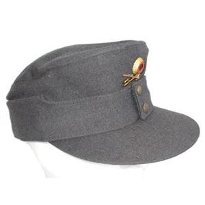 BW mountain cap with cockade and crossed swords, used